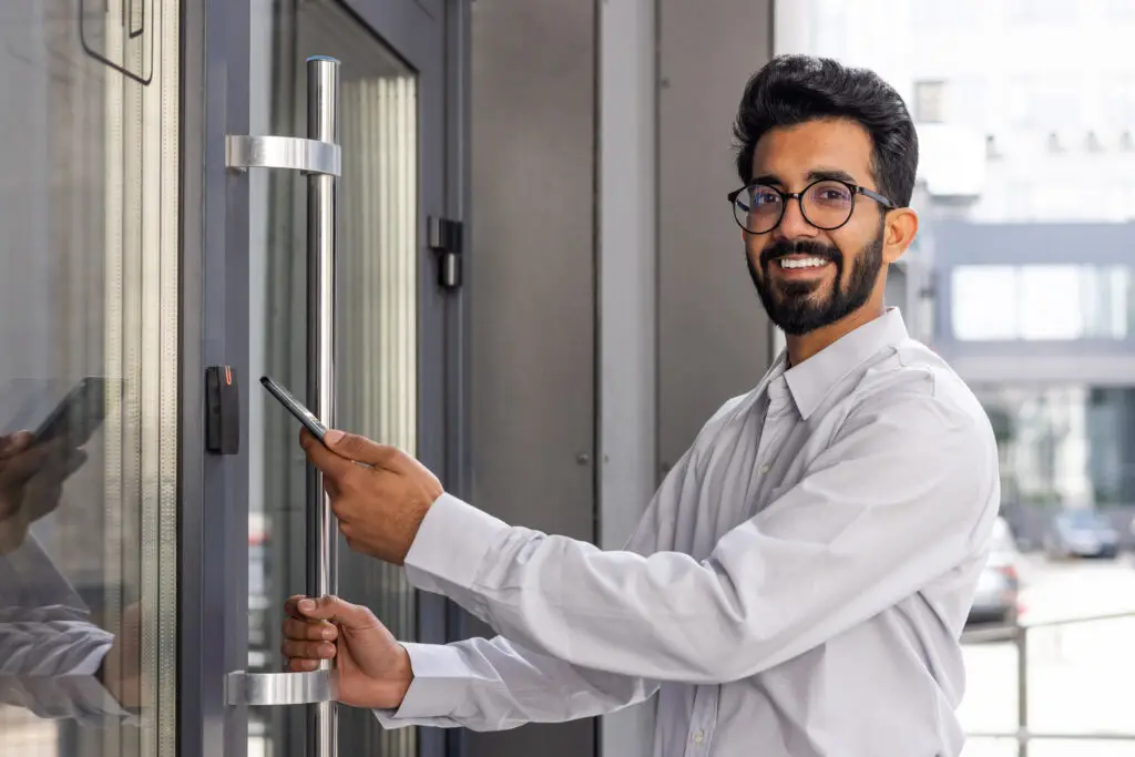 Employee using access control system to enter office