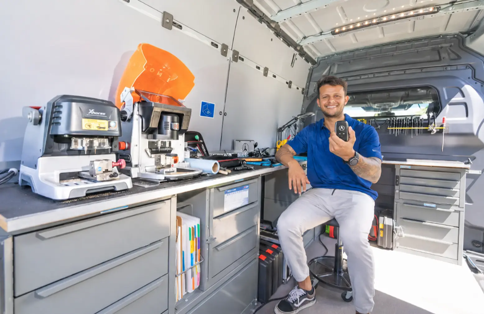 Gabriel holding an Acuaa key after programming in Honolulu